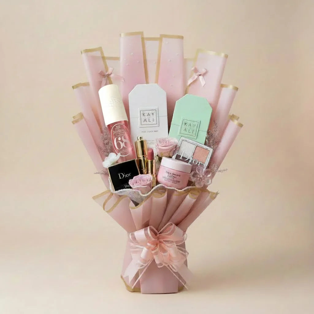 Luxury beauty gift bouquet with Kayali, Dior and Sol de Janeiro products in pink wrapping