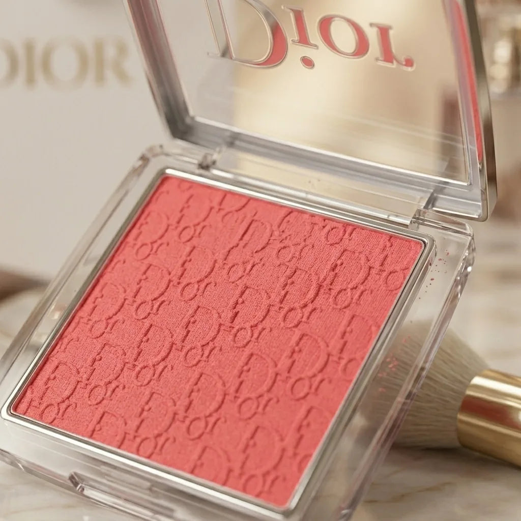 Dior blush compact with pink shade and visible Dior branding on a marble surface by Aura Luxe