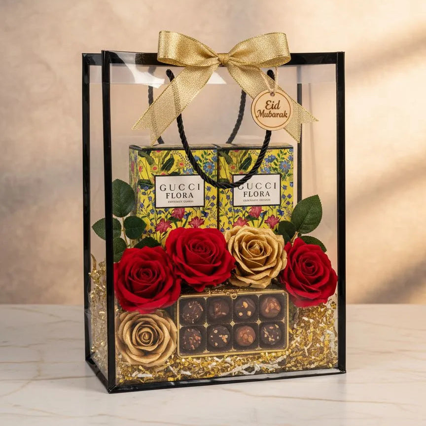 Gucci Flora Gorgeous Orchid perfume gift hamper with two boxes, red and gold roses and chocolates in a clear PVC bag with gold bow – Aura Luxe UAE