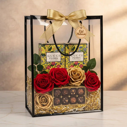 Gucci Flora Gorgeous Orchid perfume gift hamper with two boxes, red and gold roses and chocolates in a clear PVC bag with gold bow – Aura Luxe UAE