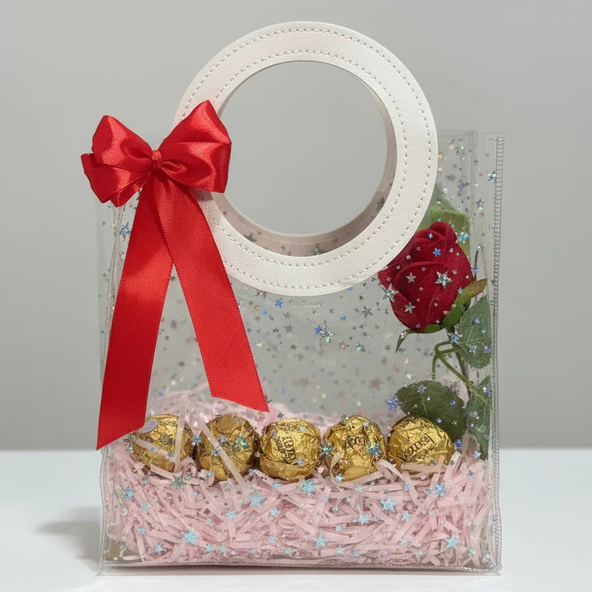 Mini clear PVC perfume gift bag with white round handles, red bow, pink filler, chocolates and red rose, empty for 1–2 perfumes – Aura Luxe UAE